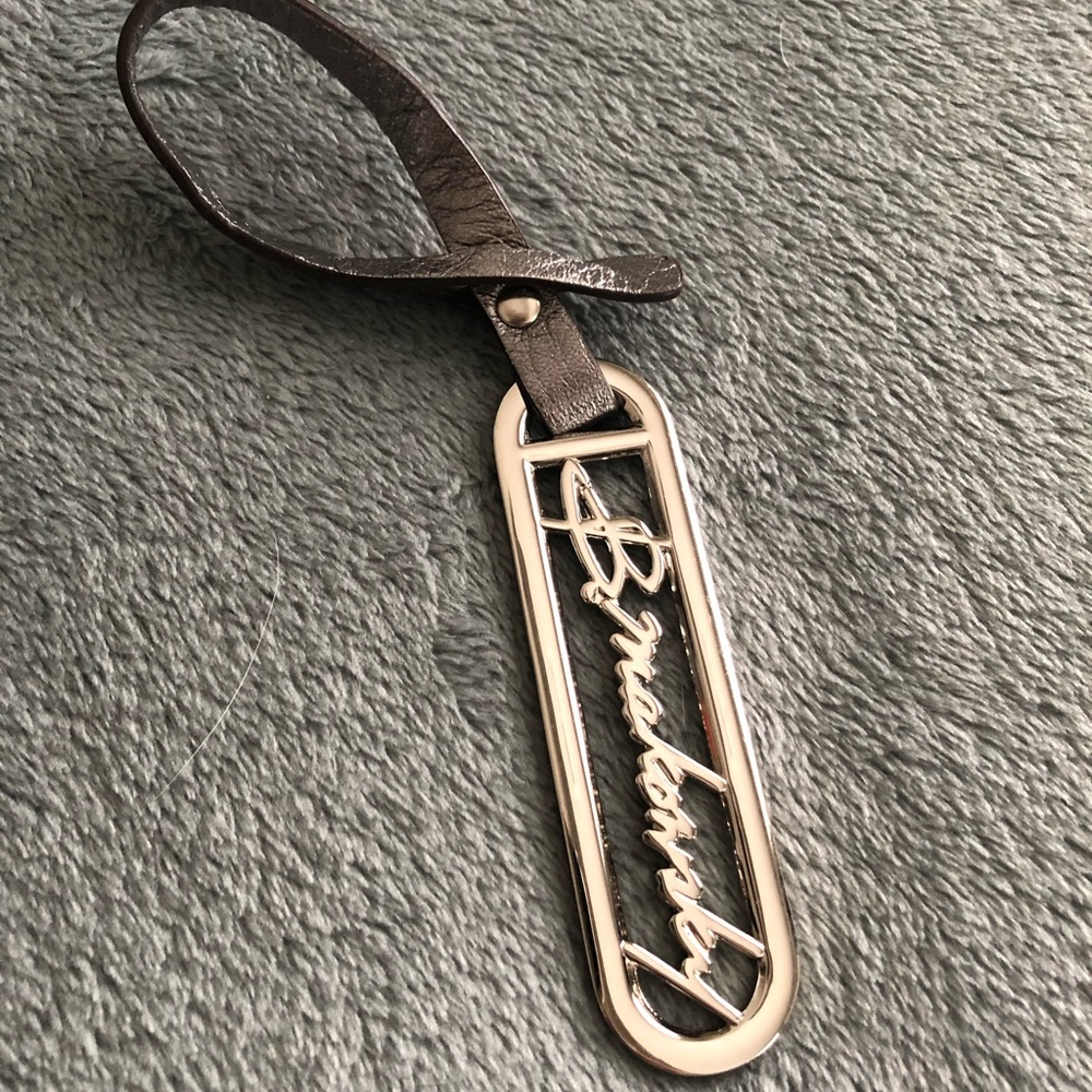 B. Makowsky purse/wallet logo charm.